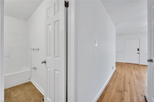 hallway with light wood-type flooring