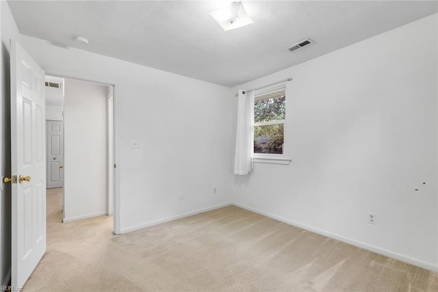 spare room with light colored carpet