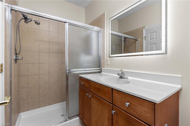 bathroom with vanity and an enclosed shower