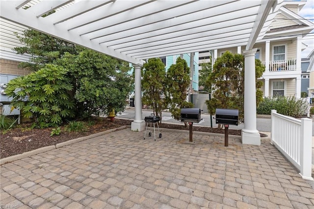 view of patio with a pergola and grilling area