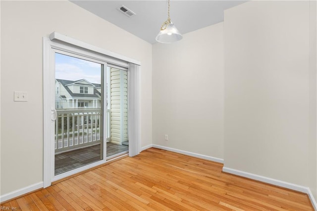 spare room with wood-type flooring