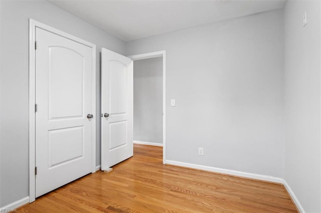 unfurnished bedroom with light wood-type flooring