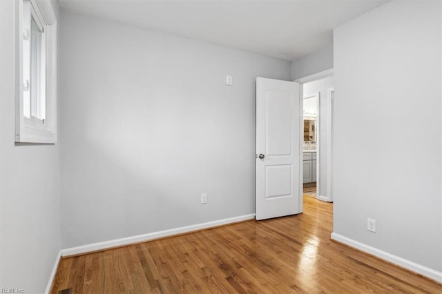 spare room with light wood-type flooring