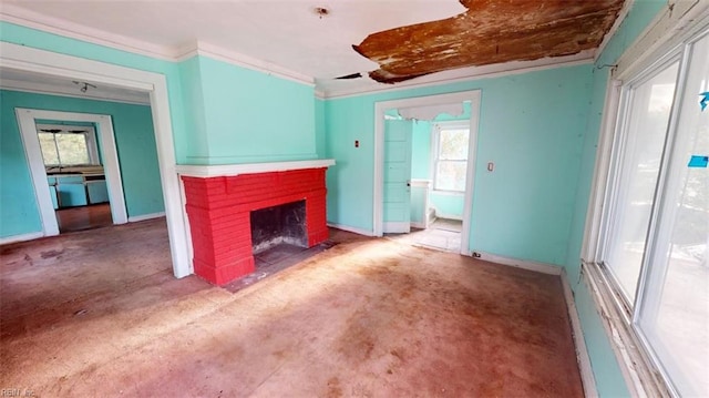 unfurnished living room with carpet flooring, a fireplace, and ornamental molding