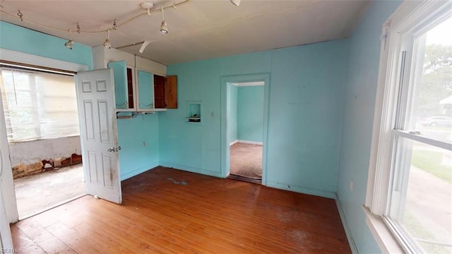 spare room with wood-type flooring