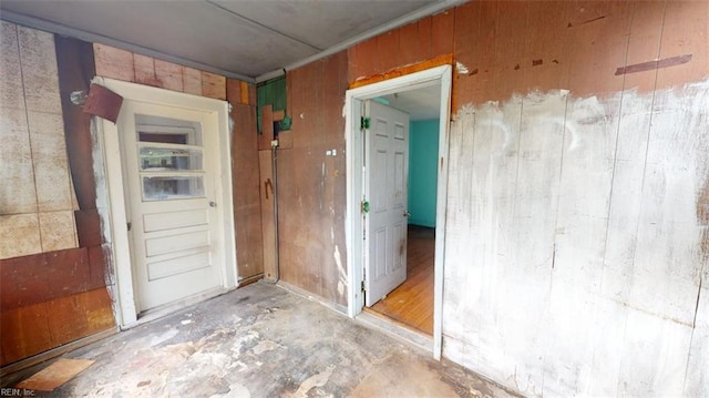 interior space featuring wood walls