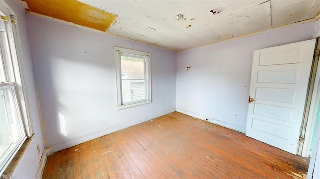 unfurnished room featuring wood-type flooring