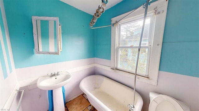 bathroom with tile patterned flooring and toilet