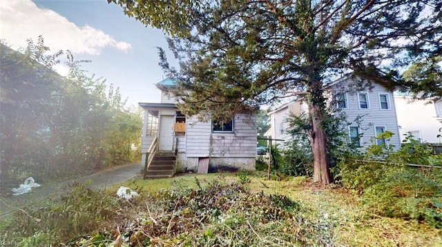 view of property hidden behind natural elements