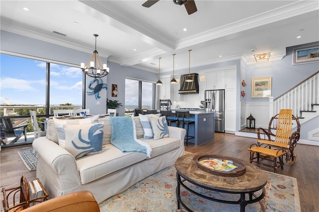 living room featuring crown molding, dark wood-type flooring, and plenty of natural light