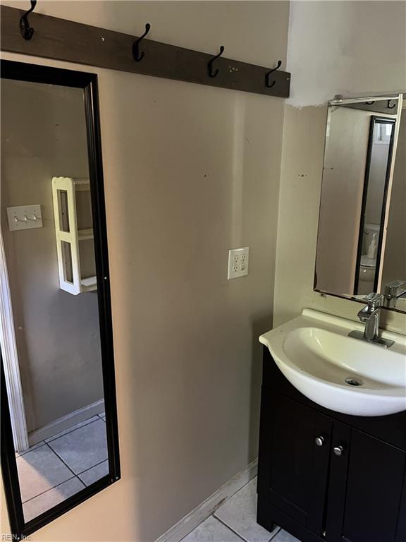 bathroom with vanity and tile patterned floors