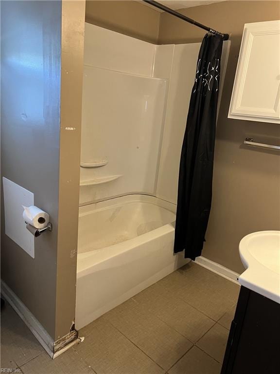 bathroom featuring vanity, shower / tub combo, and tile patterned flooring