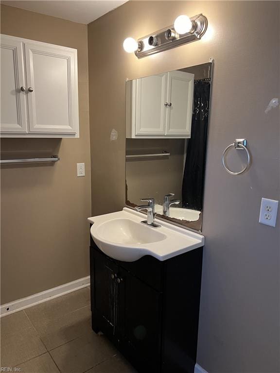 bathroom featuring tile patterned flooring and vanity