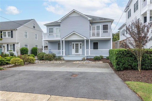 view of front of house featuring a balcony and a porch