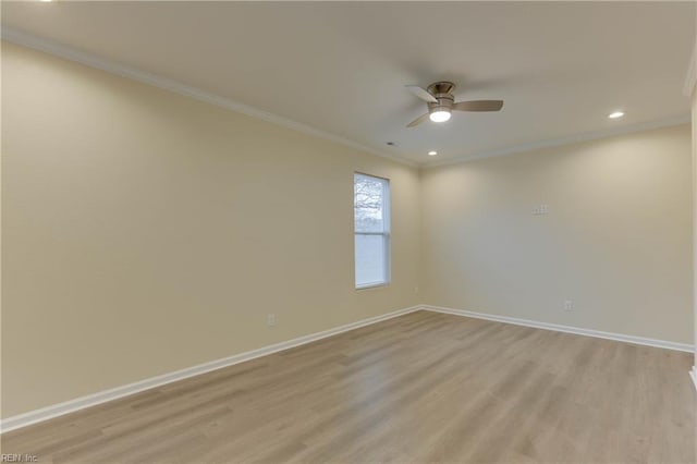 spare room with ceiling fan, ornamental molding, and light hardwood / wood-style floors