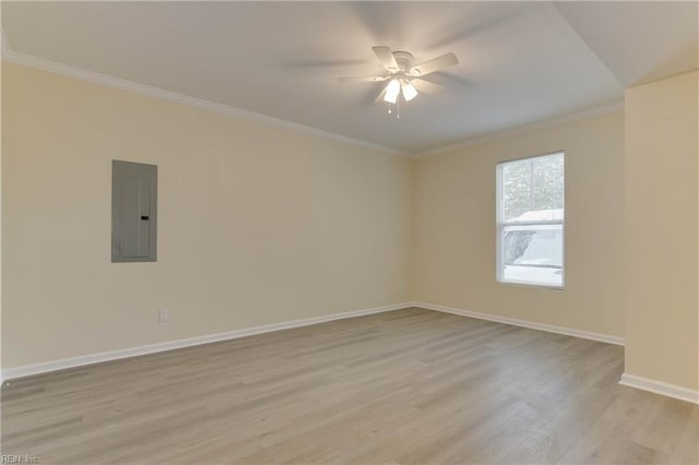 unfurnished room featuring light wood-type flooring, ceiling fan, electric panel, and crown molding