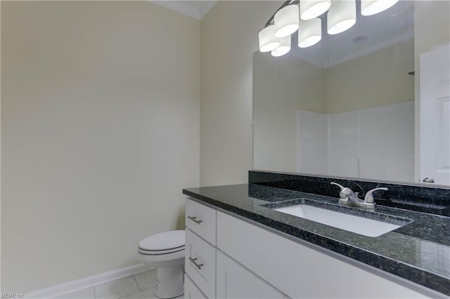 bathroom featuring tile patterned floors, crown molding, vanity, and toilet