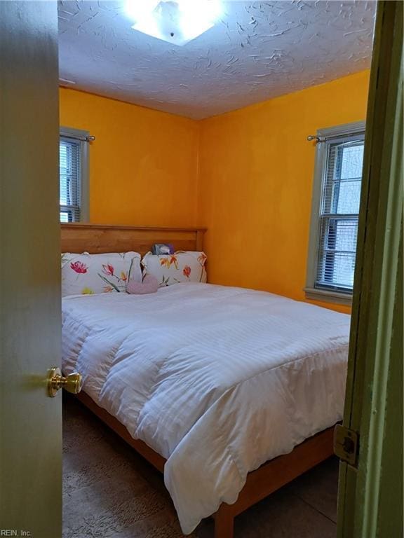 bedroom featuring a textured ceiling