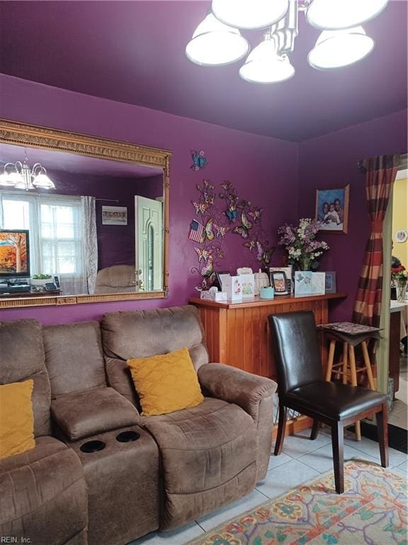 tiled living area featuring a notable chandelier