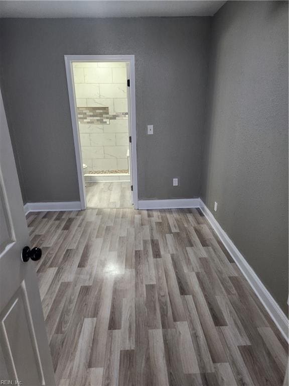 spare room with light wood-type flooring