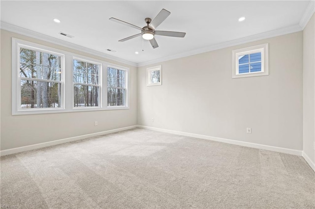 empty room featuring carpet flooring, baseboards, and ornamental molding