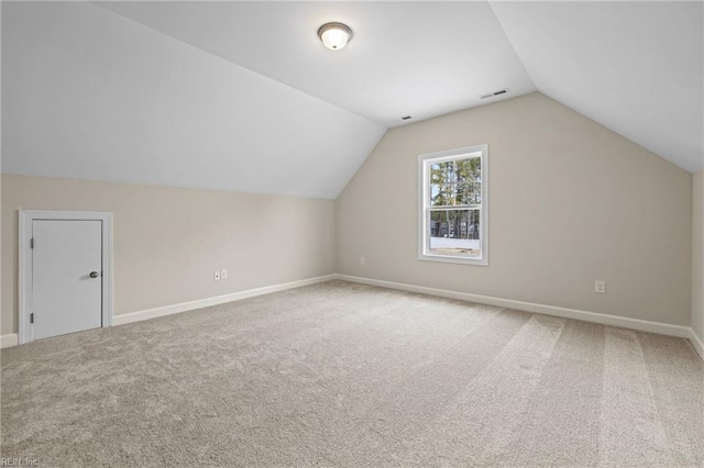 bonus room featuring visible vents, lofted ceiling, baseboards, and carpet flooring