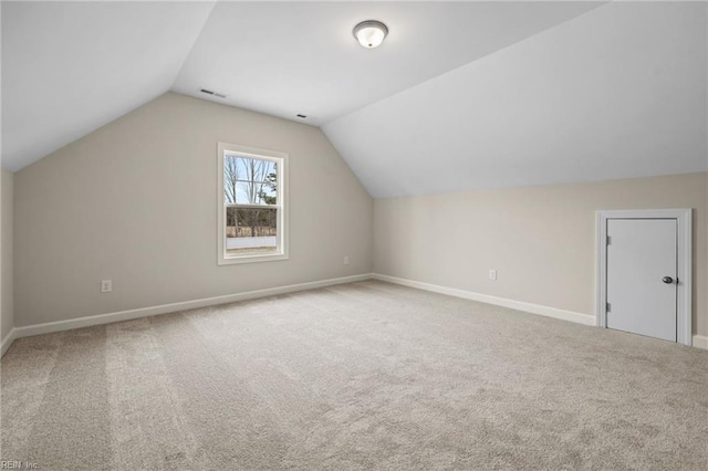 bonus room with visible vents, lofted ceiling, baseboards, and carpet flooring