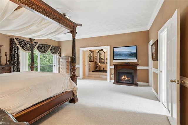 bedroom with carpet flooring and crown molding