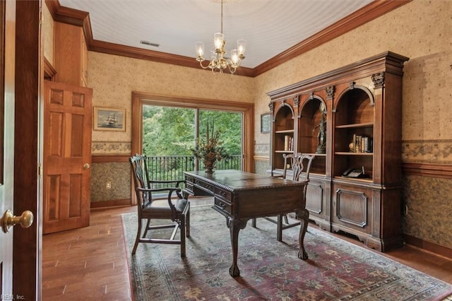 office with a chandelier, hardwood / wood-style floors, and crown molding