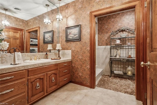 bathroom featuring vanity, tile walls, and tile patterned flooring