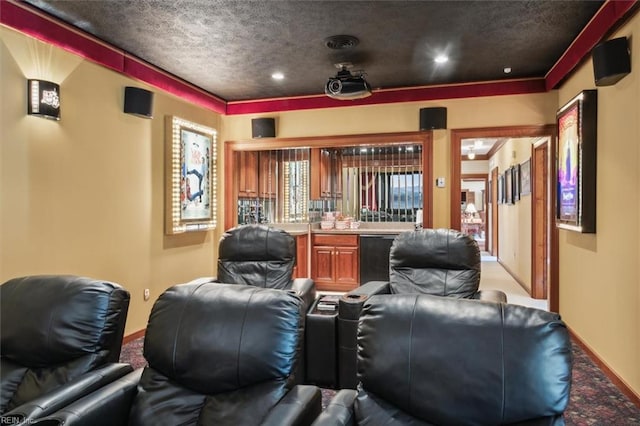 carpeted home theater with a textured ceiling