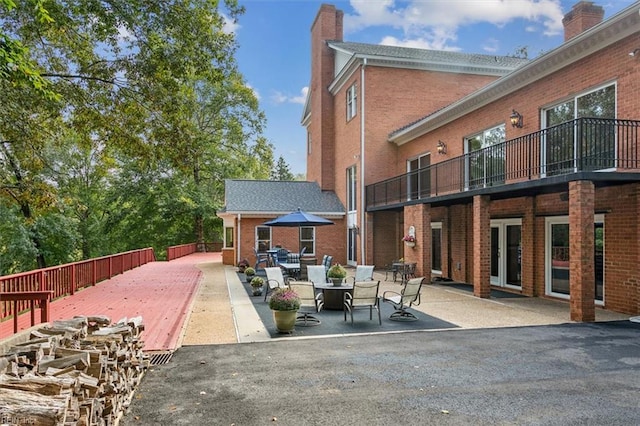 view of patio with a balcony