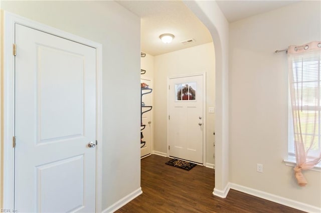 doorway to outside with dark hardwood / wood-style floors