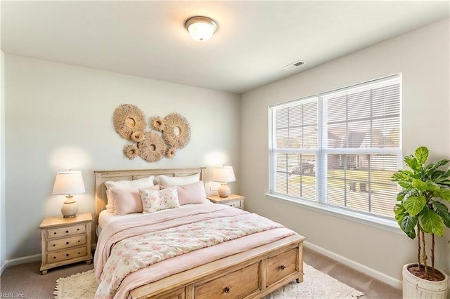 bedroom featuring light colored carpet