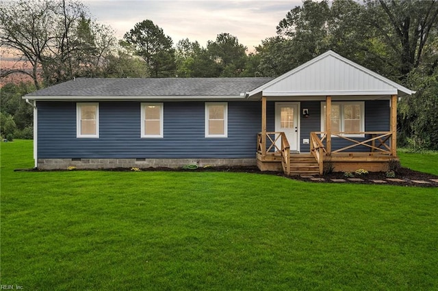 view of front of home with a yard and a porch