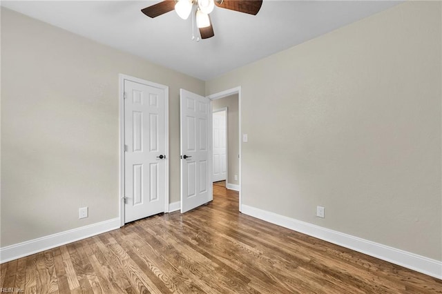 unfurnished bedroom featuring wood-type flooring and ceiling fan