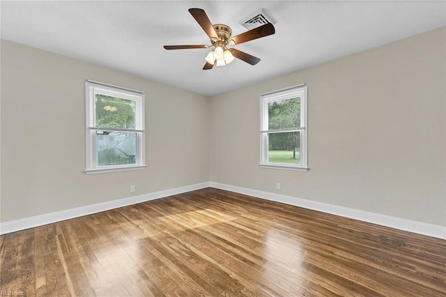 unfurnished room featuring ceiling fan and hardwood / wood-style floors