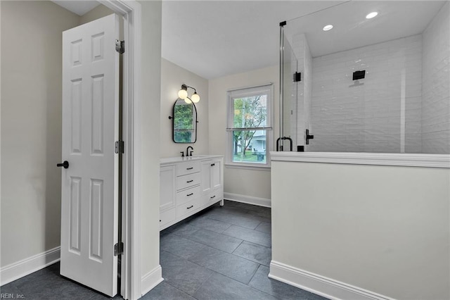 bathroom with walk in shower, tile patterned flooring, and vanity