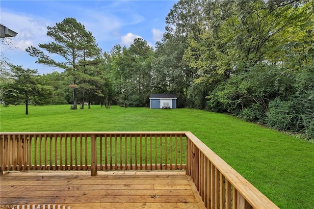 wooden deck with a storage unit and a yard