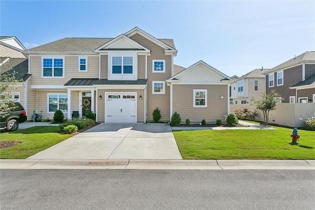 view of front of property with a garage and a front lawn