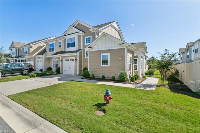 view of front of house featuring a garage and a front lawn