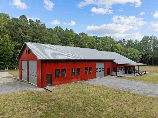 exterior space featuring a lawn and a carport