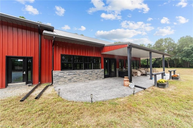 view of home's community with a patio and a yard