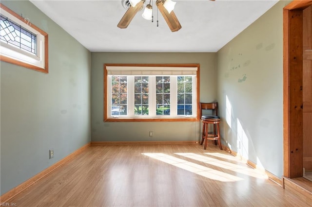 spare room with light hardwood / wood-style floors and ceiling fan