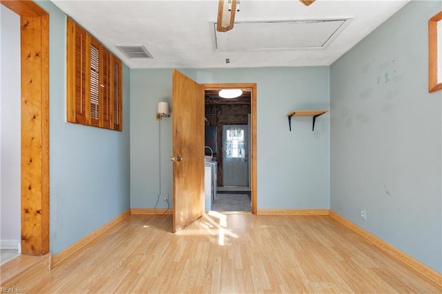 unfurnished room featuring light wood-type flooring