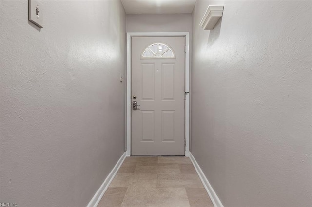 entryway featuring light tile patterned flooring