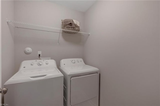 laundry room with separate washer and dryer