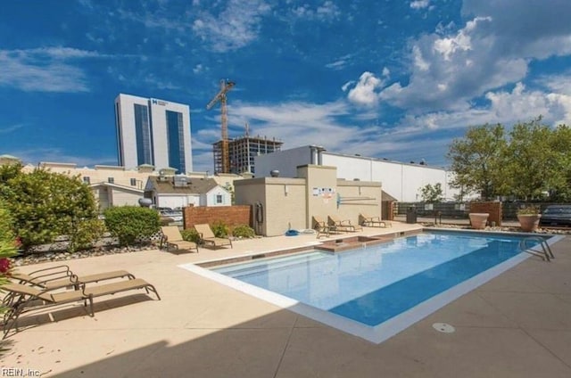 view of swimming pool with a patio