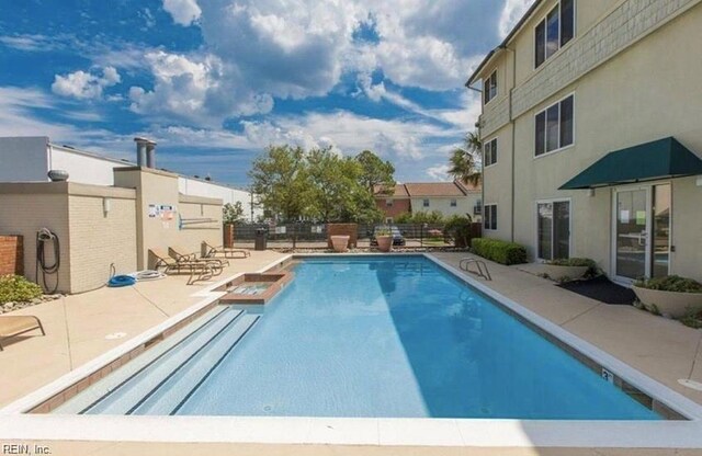 view of pool featuring a patio