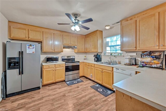 kitchen featuring stainless steel appliances, ceiling fan, sink, light brown cabinets, and light hardwood / wood-style flooring